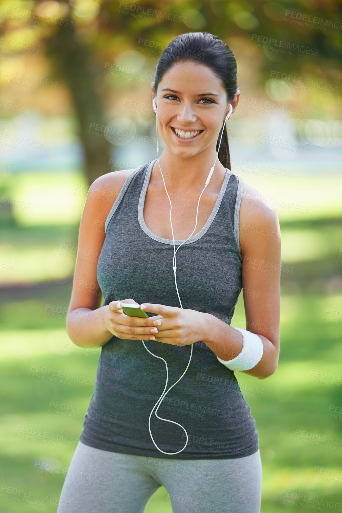 Buy stock photo Woman, portrait and listening to music for exercise in park, fitness and commitment to training for healthy body. Young lady, happy face or runner with streaming audio for outdoor workout in nature