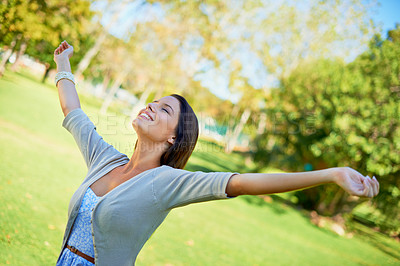 Buy stock photo Happy woman, freedom and nature for outdoor wellness, travel and fresh air in environment and summer. A young and casual person wit eyes closed and stretching arms for celebration and excited in park