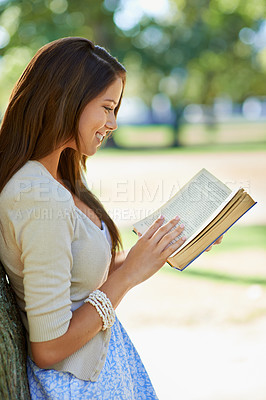Buy stock photo Happy woman, nature and reading book for learning, education or leisure in summer. Young person with story, fiction or literature for language, knowledge and studying or creative inspiration in park