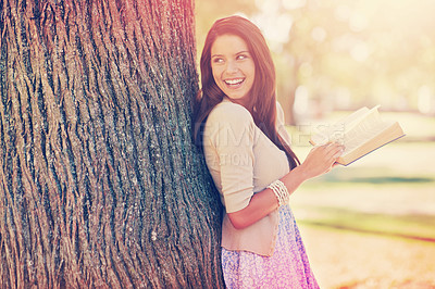 Buy stock photo Tree trunk, portrait and woman with smile for novel, book and fiction in nature to relax in park. Adult, girl and female person with confidence for knowledge, happy and joy for reading in summer