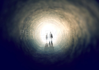 Buy stock photo A shot of two people finding an exit from a dark tunnel - ALL design on this image is created from scratch by Yuri Arcurs'  team of professionals for this particular photo shoot