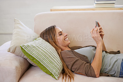 Buy stock photo Happy, phone and woman on sofa to relax on social media, networking and browse internet. Smile, home and person on couch with smartphone for communication, internet and website blog in living room