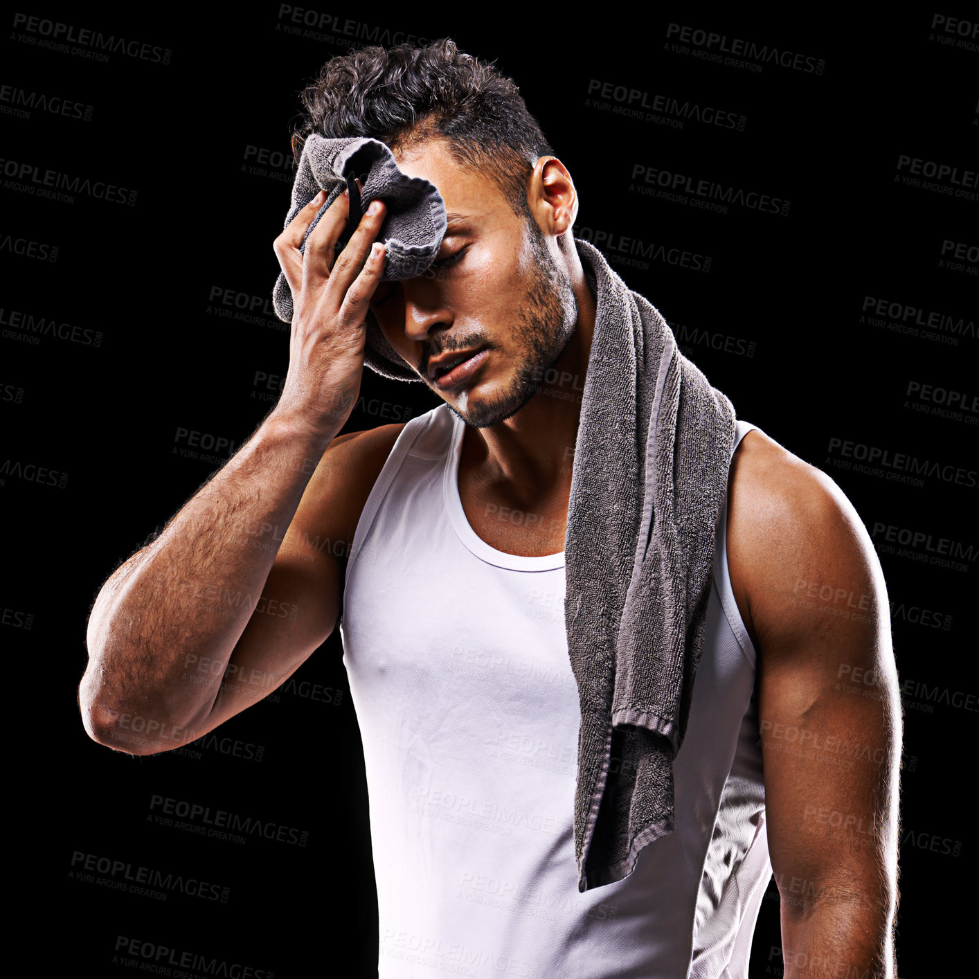 Buy stock photo Fitness, sweat and man on black background with towel for exercise, training and intense workout. Bodybuilder, sports and serious person with muscles for performance, wellness and health in studio