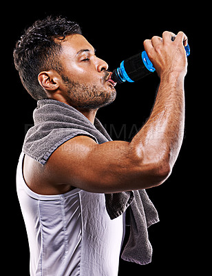 Buy stock photo Fitness, drinking and man on black background with water for exercise, training and intense workout. Bodybuilder, sports and thirsty person with liquid for hydration, wellness and health in studio