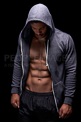 Buy stock photo Fitness, serious and man in hoodie on black background for exercise, training and intense workout. Sweat, sports and person with strong body and muscles for performance, wellness and health in studio