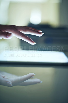 Buy stock photo Closeup of a young woman holding a touch sensitive digital tablet