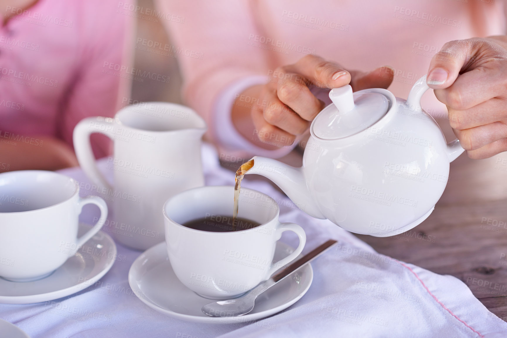 Buy stock photo Shot of a woman pouring coffee