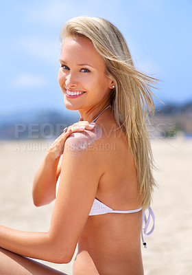 Buy stock photo Woman, portrait and bikini with sunscreen cream on beach for skincare protection or summer travel, dermatology or apply. Female person, shoulder and tan lotion in Miami for holiday, seaside or resort