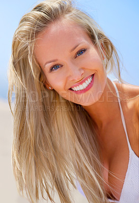 Buy stock photo Woman, portrait and outdoor beach, travel and breeze for ocean holiday or summer vacation. Happy female person, wind and smile for weekend trip on sand, closeup and confidence in outdoor nature