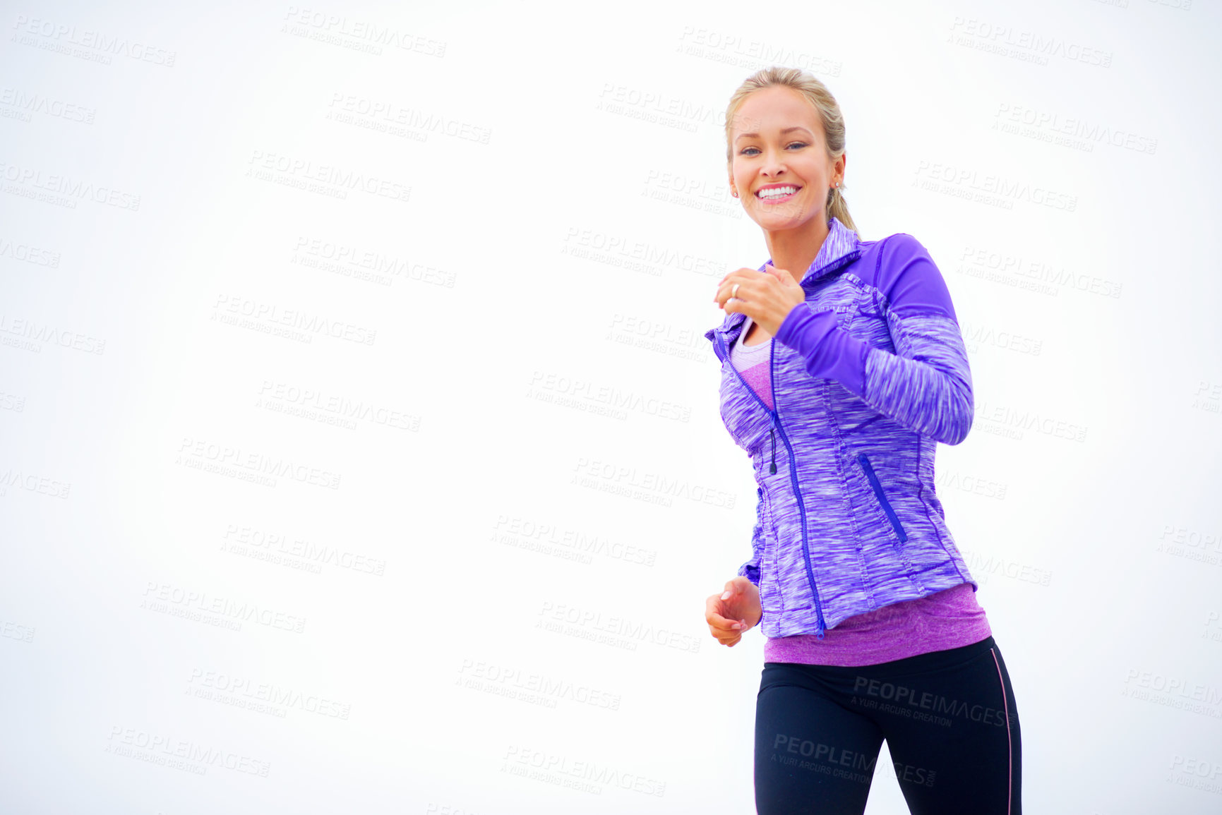 Buy stock photo Shot of a young woman out for a jogg