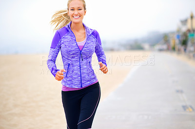 Buy stock photo Portrait, runner or happy woman at beach running for exercise, training or fitness workout at sea. Sports, athlete and healthy female person on road for cardio endurance, wellness or outdoor activity