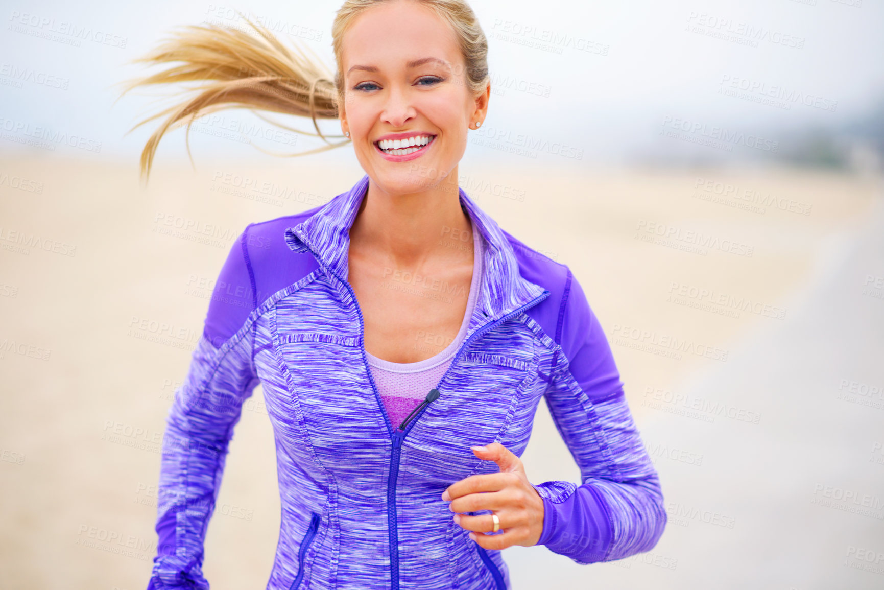 Buy stock photo Portrait, athlete or happy woman at beach running for exercise, training or fitness workout at sea. Sports, excited runner and healthy female person on road for cardio endurance, wellness or activity