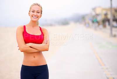 Buy stock photo Woman, portrait and fitness on the beach with arms crossed, confidence and smile with wellness and outdoor. Exercise, athlete and sports with abs or flat stomach, marathon or race for cardio workout