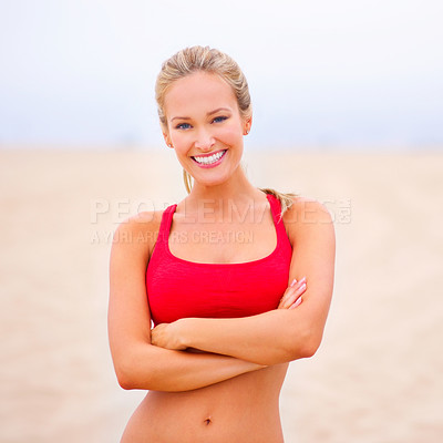 Buy stock photo Woman, portrait and exercise on the beach with arms crossed, confidence and smile with wellness and outdoor. Fitness, athlete and sports with happiness for health, marathon or race for cardio workout