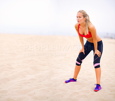 Buy stock photo Woman, run on beach and rest with breathing, tired from fitness with cardio and workout outdoor for health. Training, challenge and performance with action, relax after exercise and break from race