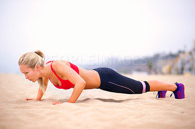 Buy stock photo Woman, pushup and training by beach, exercise and practice for strength in sportswear. Female person, outdoors and fitness for healthy body on sand, muscle and cardio challenge for active workout