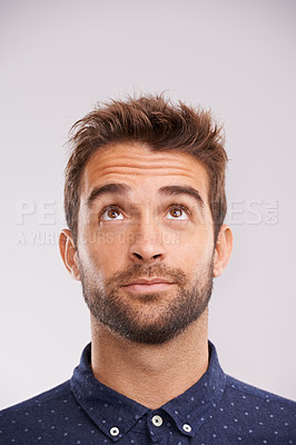 Buy stock photo Thinking, looking up and man in studio with solution, ideas and relax with eyes and mockup. Isolated, gray background and male model face think and distracted with planning with decision alone