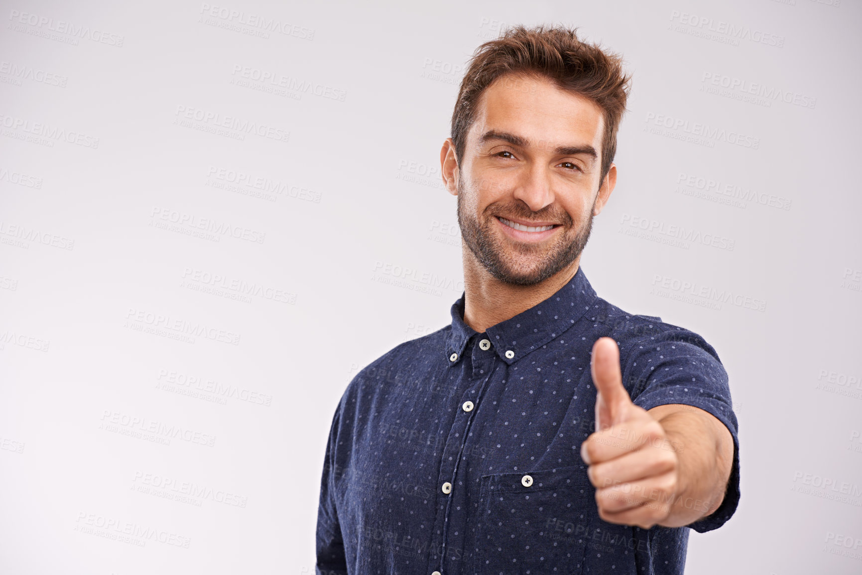 Buy stock photo Support, portrait and man with thumbs up in studio, background and agreement in mockup space. Hand, gesture and happy for success in business with confidence and emoji for ok, thank you and yes
