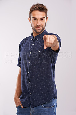 Buy stock photo Young man, portrait and pointing in studio for choice, happy and recruitment by grey background. Hr consultant, smile  face and opportunity or yes for decision, vote and positive review for winner
