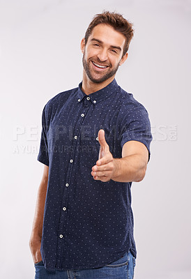 Buy stock photo Welcome, handshake and portrait of man in studio, background and introduction in mockup space. Hand, gesture and happy networking for business with confidence and hr person say hello or thank you