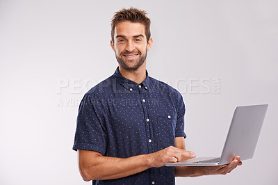 Buy stock photo Businessman, portrait or research on laptop in studio, internet or confidence for solution on fashion project. Designer, creative idea or computer for productivity or connectivity by grey background