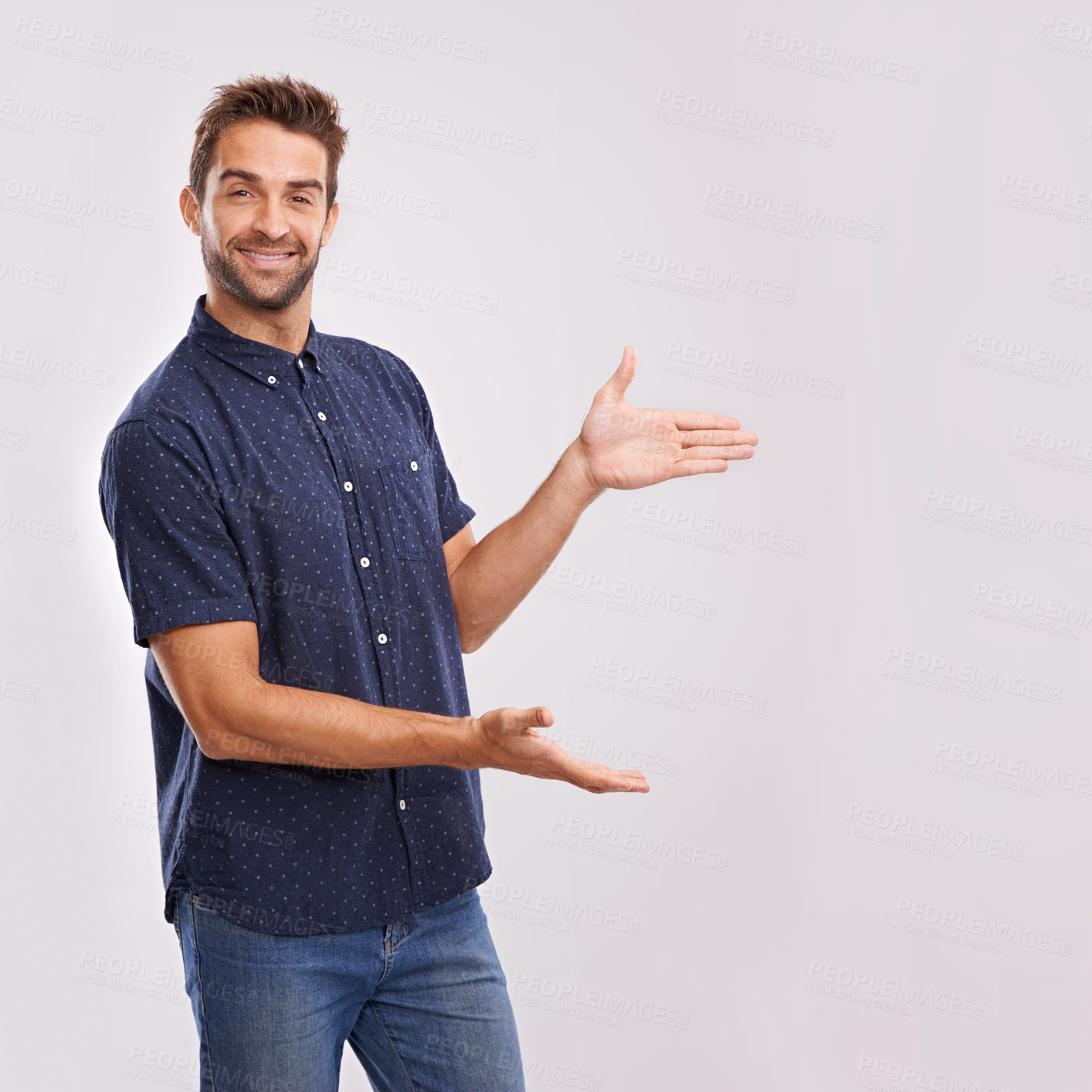 Buy stock photo Happy man, studio and portrait with pointing to mockup and hand gesture for sign or advertising. Model, face and positive for show to choice or copy space, information and branding by grey background