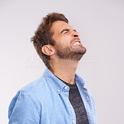 Buy stock photo Burnout, angry and frustrated with man, stress and facial expression on a grey studio background. Body language, person and model with emotions and furious with anxiety and anger with aggressive