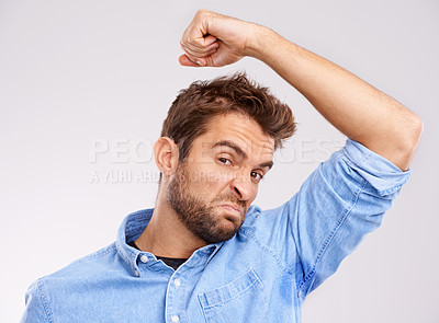 Buy stock photo Man, smell armpit and bad hygiene, body odor with stink and sweat stain isolated on white background. Hyperhidrosis, poor hygiene and dirty, foul or negative with disgust for underarm in studio