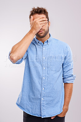Buy stock photo Regret, stress and face palm with man in studio for embarrassment, thinking and headache. Sad, shame and tired male person with anxiety, fatigue and bad memory on white background with hand on head
