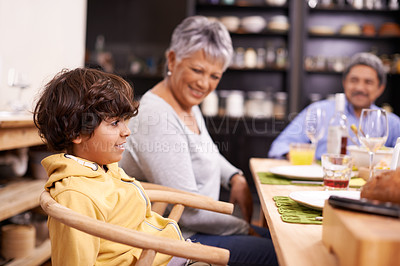 Buy stock photo A happy family eating dinner at home