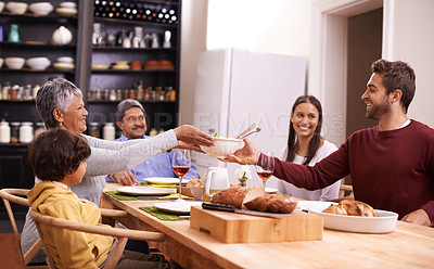 Buy stock photo Happy, big family and sharing with food for thanksgiving dinner or passing meal at the table. Grandparents, parents and child with smile for dining, eating or lunch in happiness together at house
