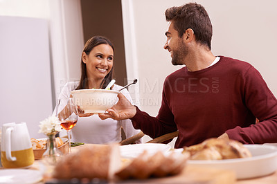 Buy stock photo Smile, dinner and couple at table sharing food, and drinks for celebration in home. Social event, happy man and woman at thanksgiving lunch together with high angle, relax and romantic holiday date
