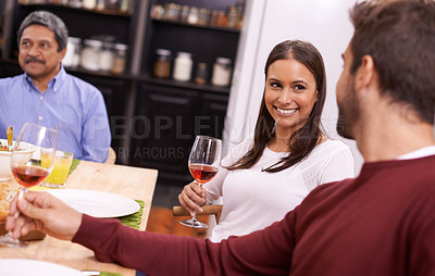 Buy stock photo Happy woman, wine and family with drink for dinner, toast or bonding on thanksgiving at the table. Group of people with smile for alcohol, dining or enjoying lunch together in happiness at the house