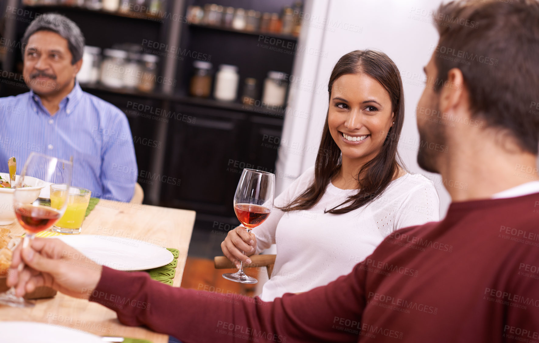 Buy stock photo Happy woman, wine and family with drink for dinner, toast or bonding on thanksgiving at the table. Group of people with smile for alcohol, dining or enjoying lunch together in happiness at the house
