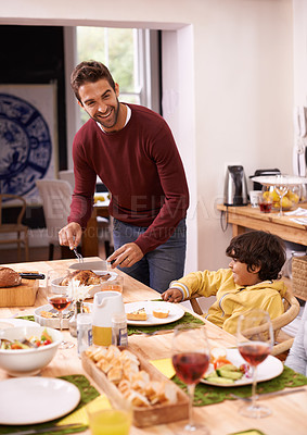 Buy stock photo A father and son enjoying a family lunch