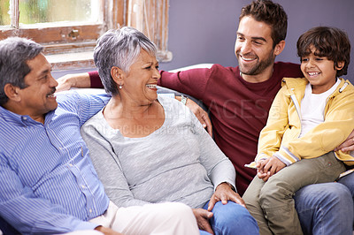 Buy stock photo Grandparents, father and child on sofa in home for bonding, relationship and relax together. Big family, happy and senior parents, dad and young boy for holiday, laughing and weekend in living room
