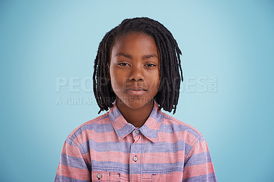 Buy stock photo African teenager, face and fashion in studio with creative, style and confidence on a blue background. Portrait of young and cool model, student or boy in natural hair and casual or trendy clothes 