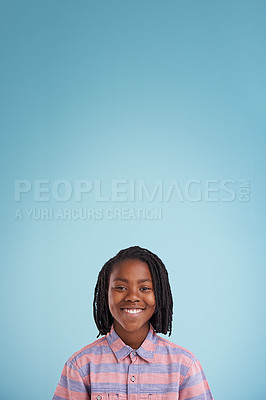 Buy stock photo Children, mockup and portrait of black boy in studio with space for presentation, news or info on blue background. Face, smile and happy teen model with poster for announcement, offer or deal promo