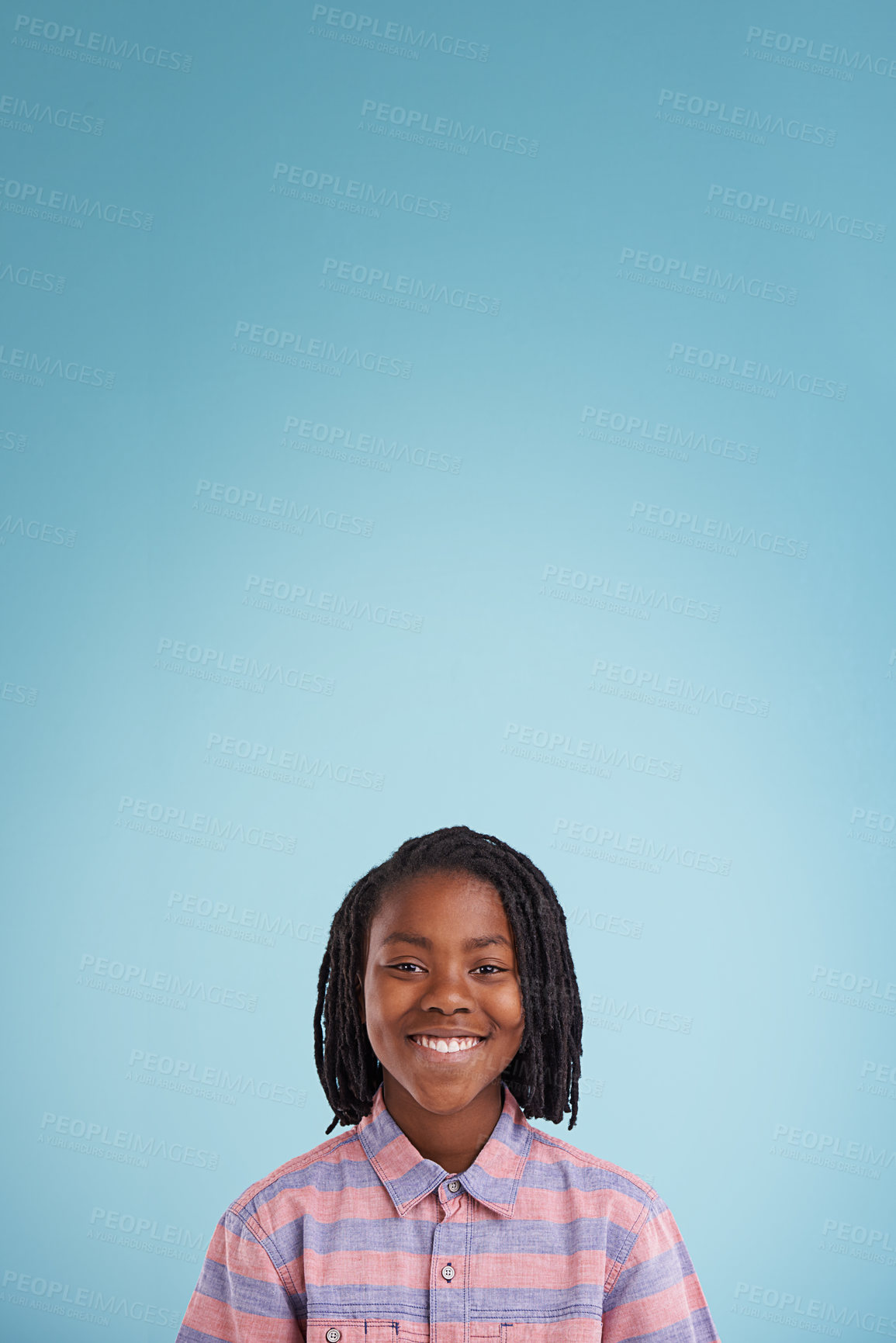 Buy stock photo Children, mockup and portrait of black boy in studio with space for presentation, news or info on blue background. Face, smile and happy teen model with poster for announcement, offer or deal promo