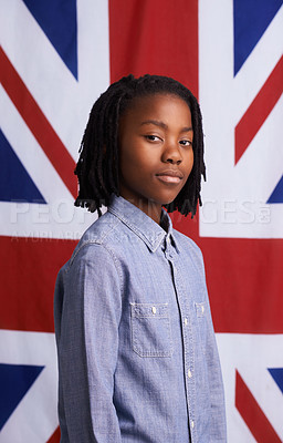 Buy stock photo Portrait of a proud young boy standing in front of the Union Jack