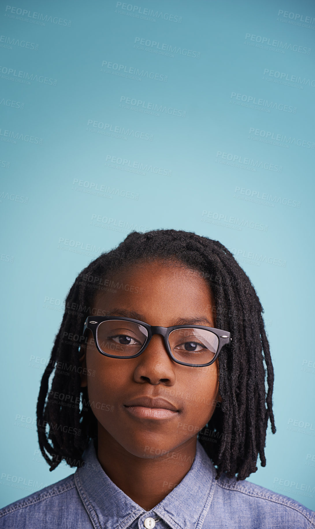 Buy stock photo Vision, glasses or black kid portrait in studio for eye care, wellness or optometry on blue background. Frame, mockup or face of teen male model with eyesight, prescription or ophthalmology testing