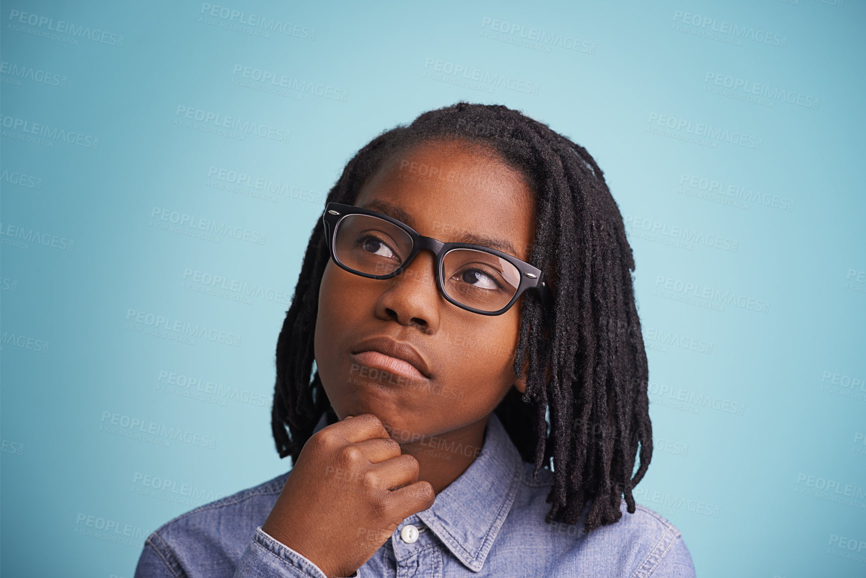 Buy stock photo Thinking, glasses or black kid in studio with vision, solution or problem solving guess on blue background. Question, why or African teen model with emoji idea for brainstorming, memory or reflection