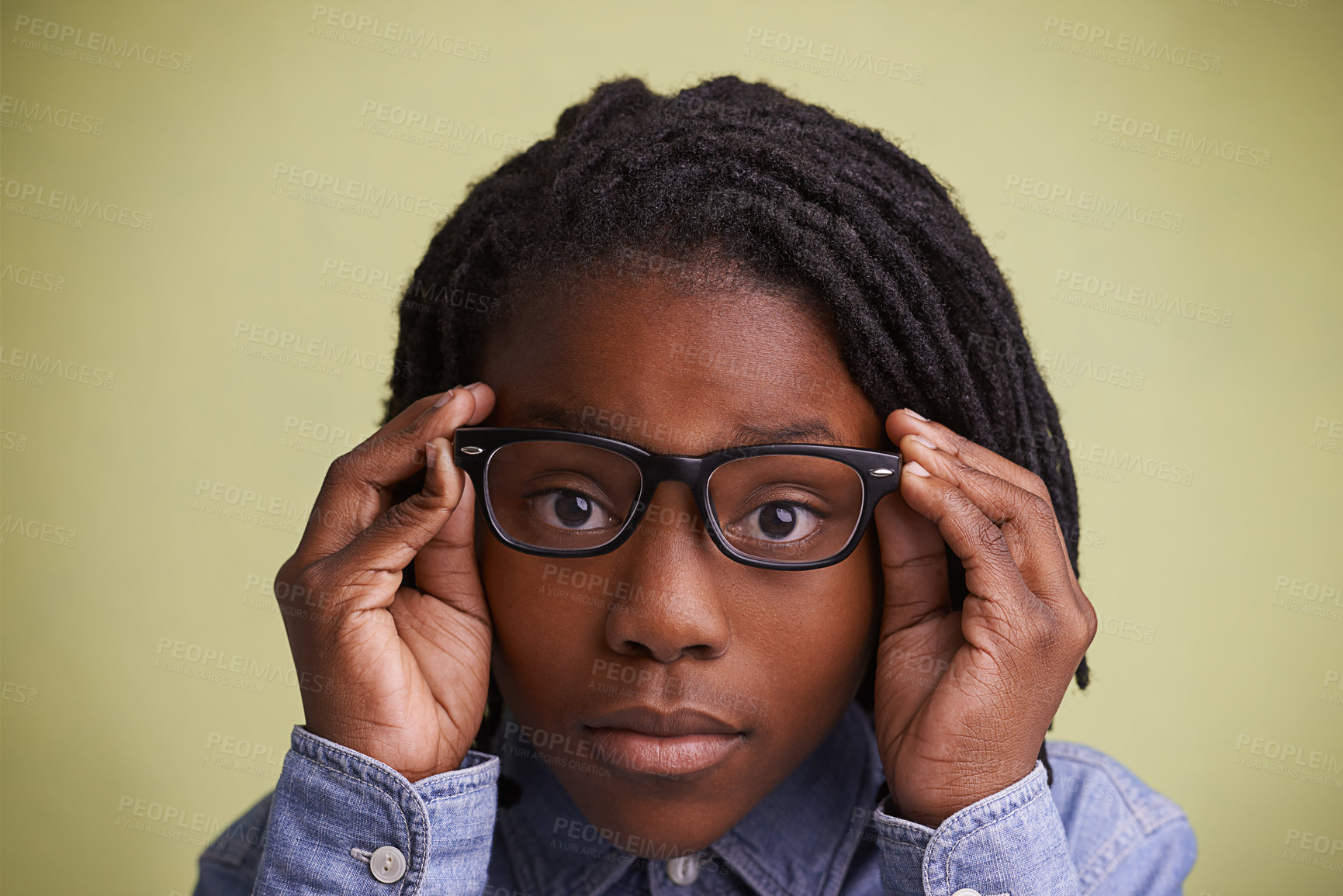 Buy stock photo Glasses, vision and boy kid portrait in studio for eye care, wellness or optometry on green background. Frame, mockup or face of teen male model with eyesight, prescription or ophthalmology testing