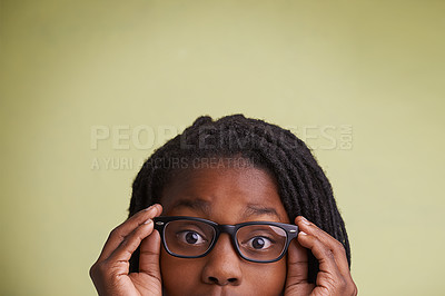 Buy stock photo Glasses, mockup or boy kid portrait in studio for eye care, wellness or optometry on green background. Frame, space or face of teen male model with eyesight, prescription or vision, optics or testing