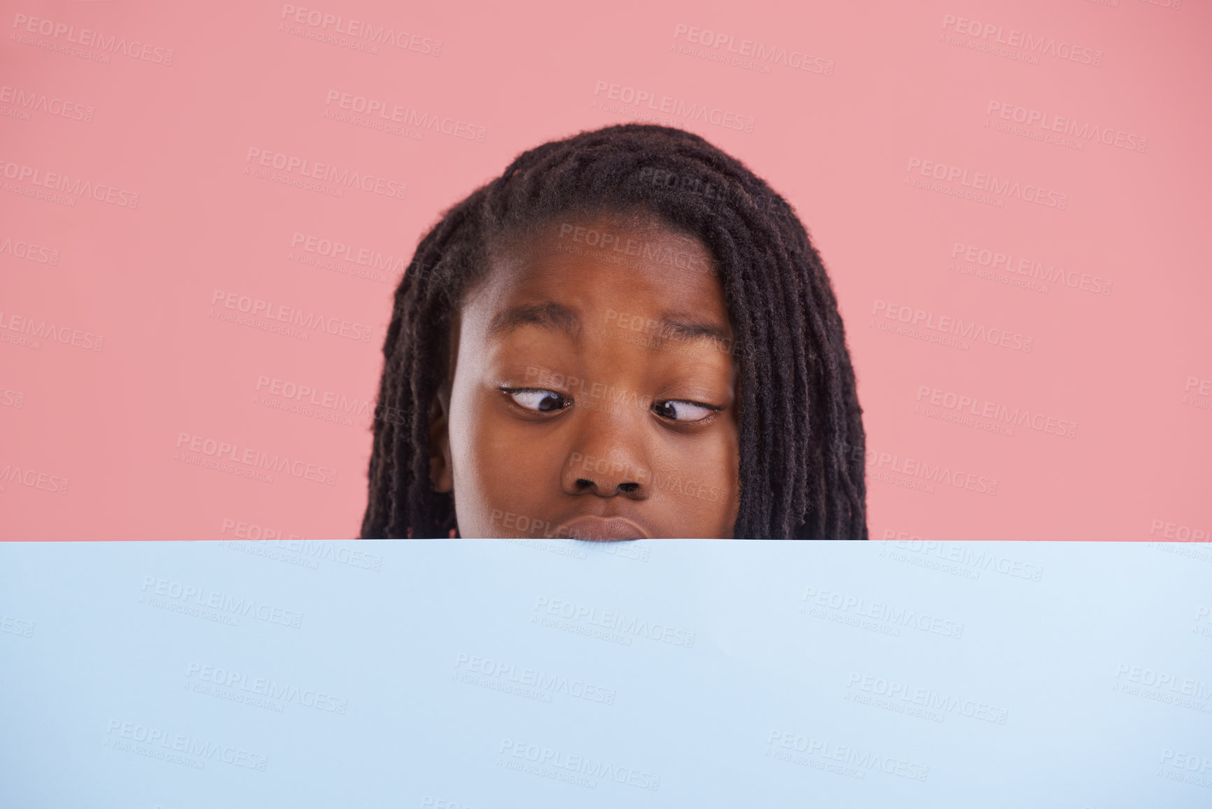 Buy stock photo Poster, funny or boy child with cross eyes on mockup in studio for announcement, offer or info on pink background. Banner, comic or teen model with billboard presentation for silly, news or promo