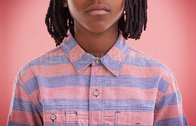 Buy stock photo Fashion, child and shirt with style, trendy and modern clothing of a African boy in a studio. Youth, hipster and casual clothes with a kid and cool teen top with pink background and serious face