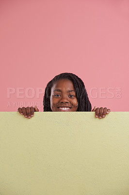 Buy stock photo Child, portrait and poster mockup in studio for advertising for fun education, happy and cool learning. Face of african teenager or student with space, information or opportunity on pink background