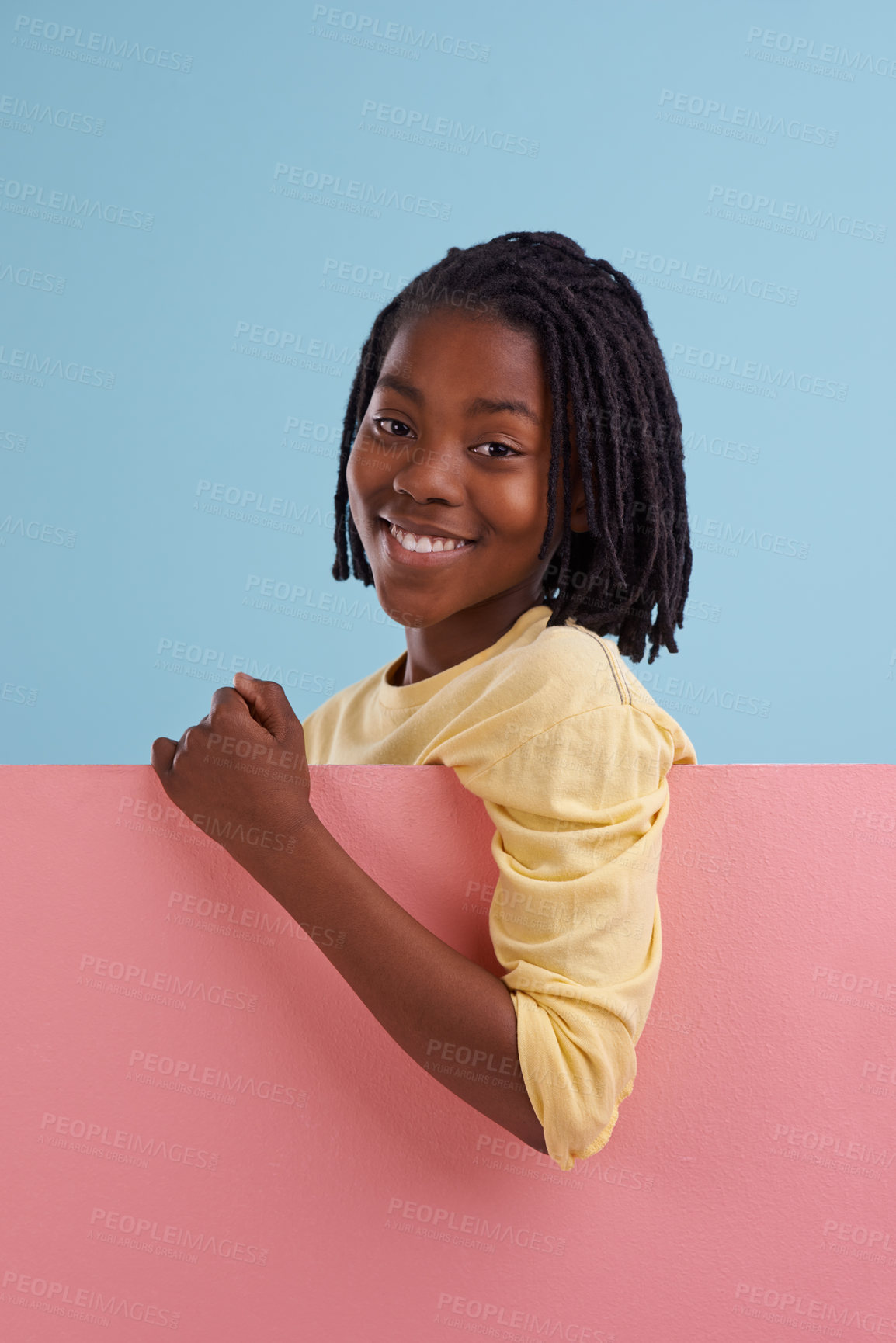 Buy stock photo Banner, portrait or happy boy child with mockup in studio for announcement, offer or info on blue background. Poster, face or teen model smile with billboard presentation for news, promo and opinion