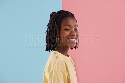 Buy stock photo Happy teenager, portrait and fashion in studio with creative color, style and blue and pink background. Face of young and cool African model or boy in natural hair and casual clothes with pastel 