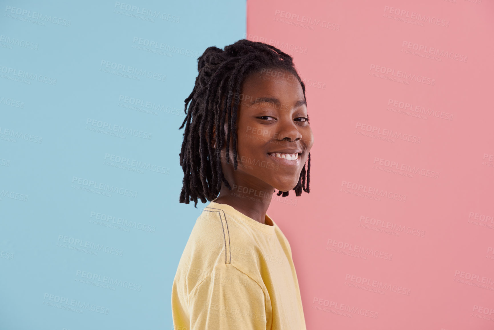 Buy stock photo Happy teenager, portrait and fashion in studio with creative color, style and blue and pink background. Face of young and cool African model or boy in natural hair and casual clothes with pastel 